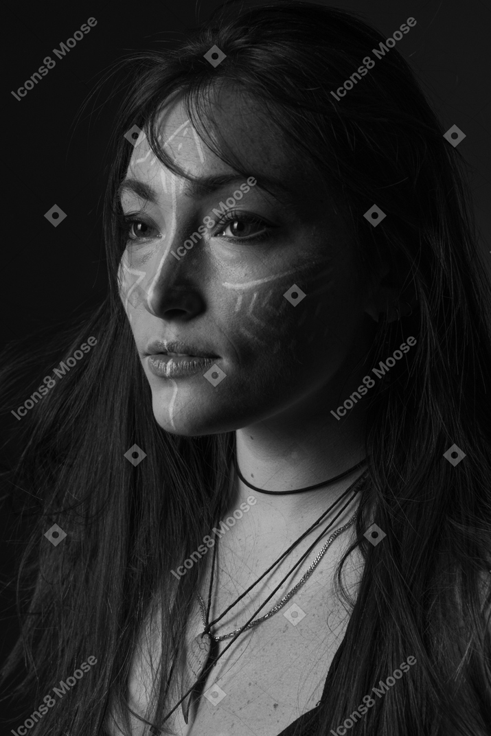 A woman with white paint on her face