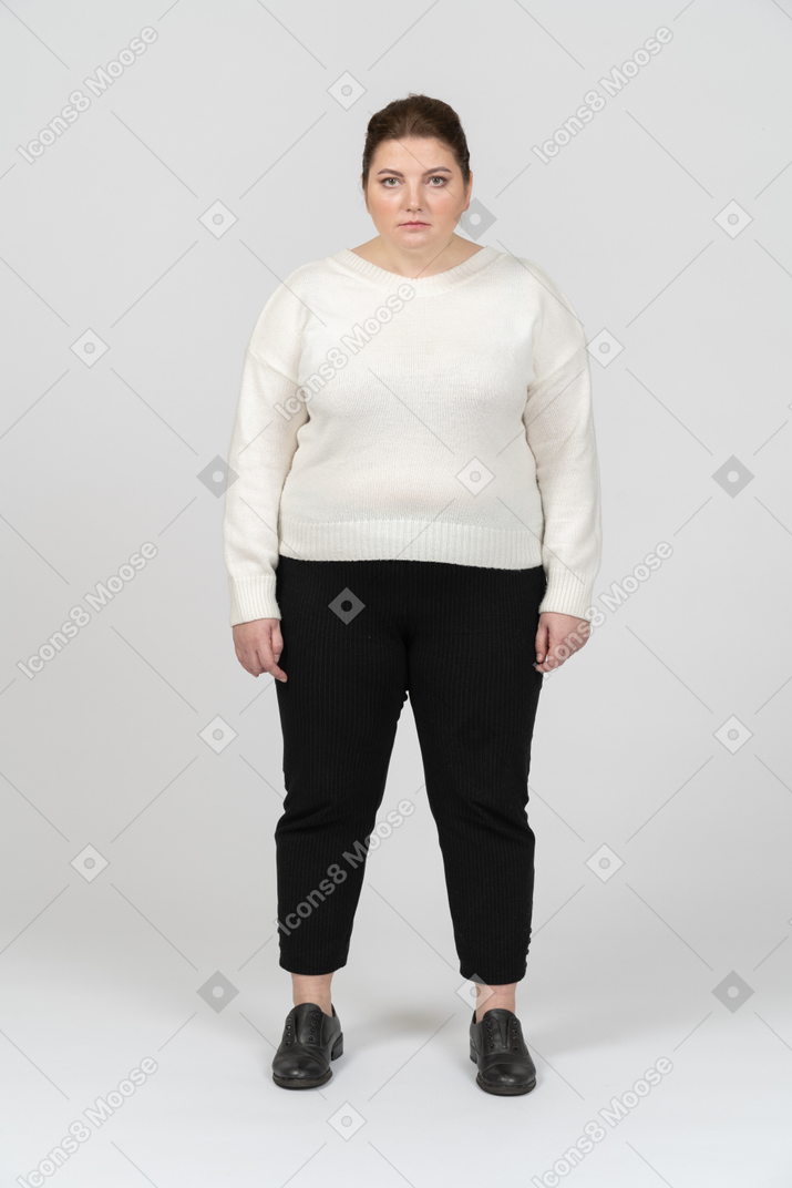 Sad woman in casual clothes looking at camera