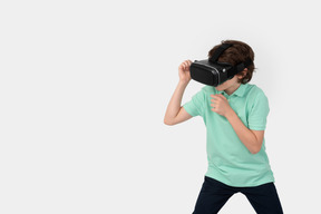 Scared boy in virtual reality headset