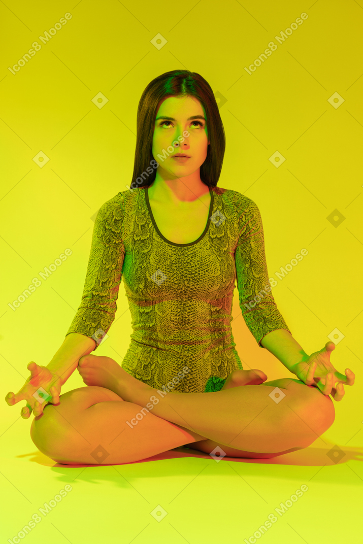 Annoyed female practicing yoga