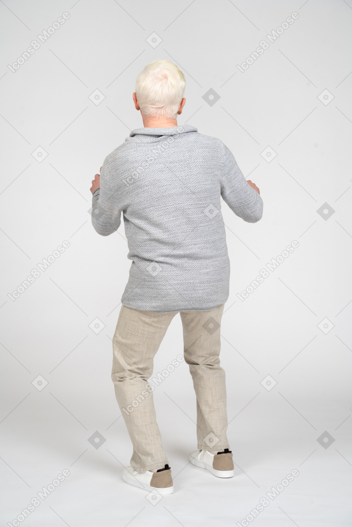 Back view of a man with knees bent