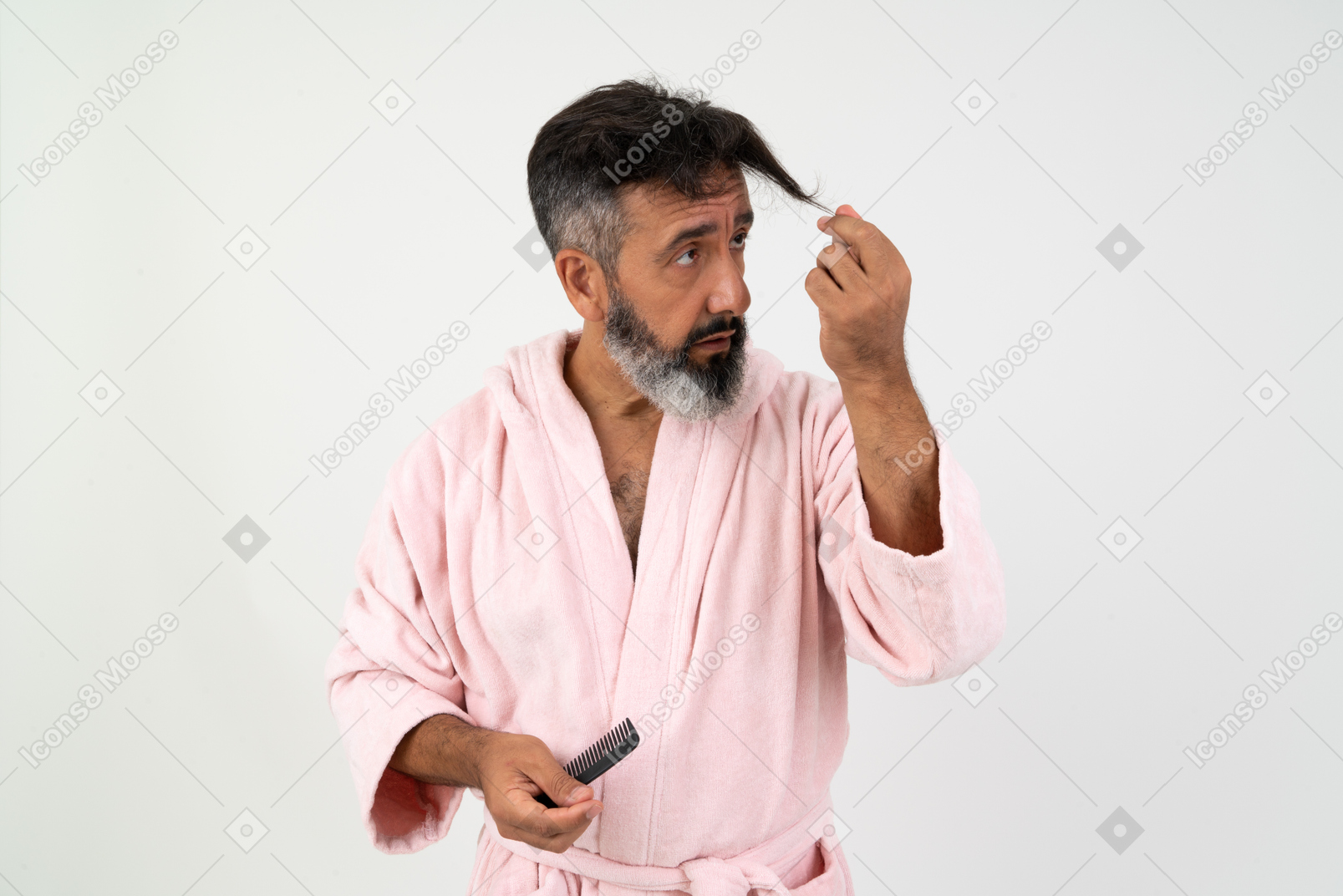 Mature man looking at his hair