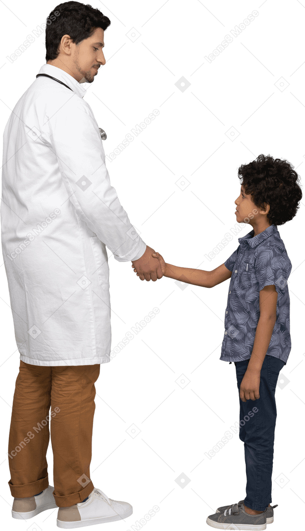 Boy and doctor shacking hands