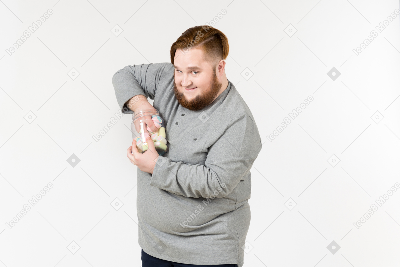 Big bearded man trying to reach marshmallows from the jar