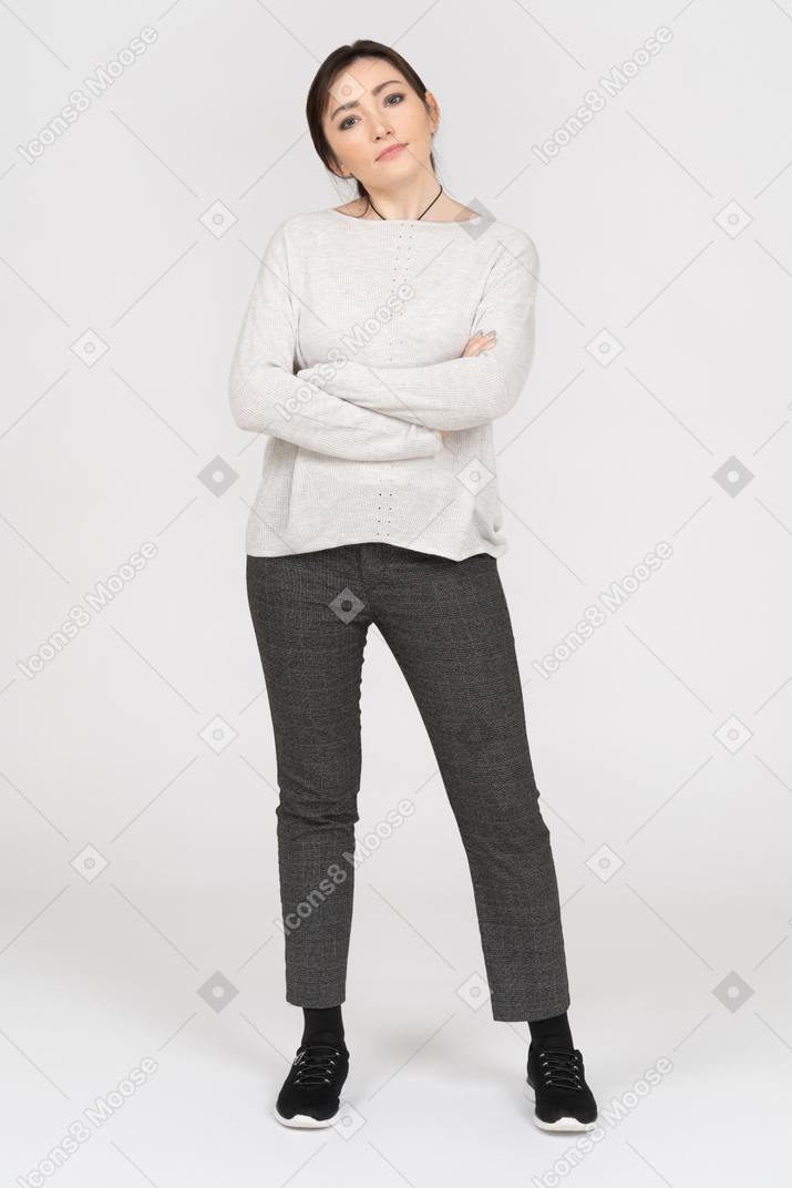 Caucasian woman posing with folded arms