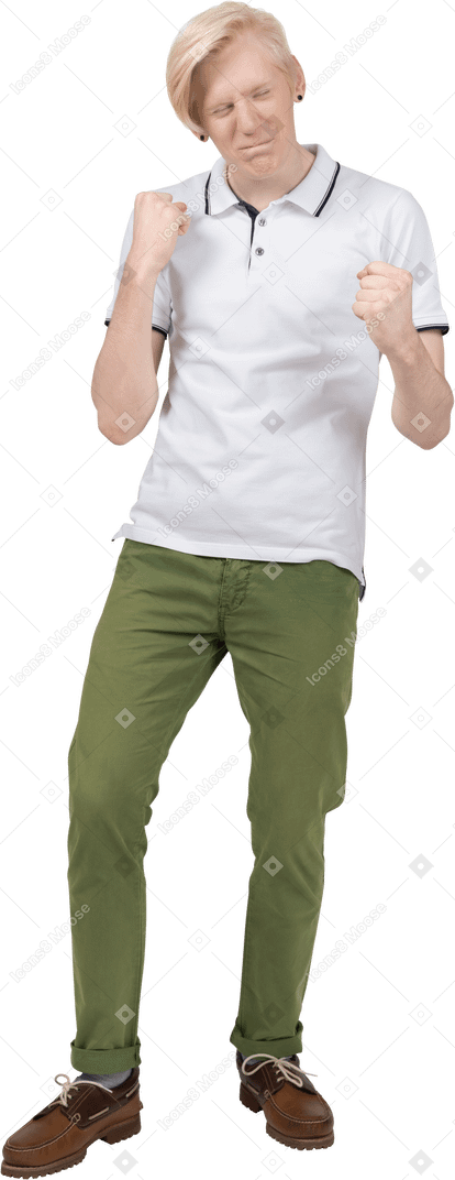 Cheerful young man with raised arms