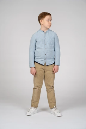 Front view of boy in casual clothes looking aside