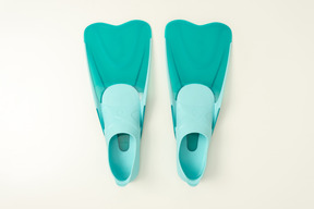 Blue swimming fins on a white background