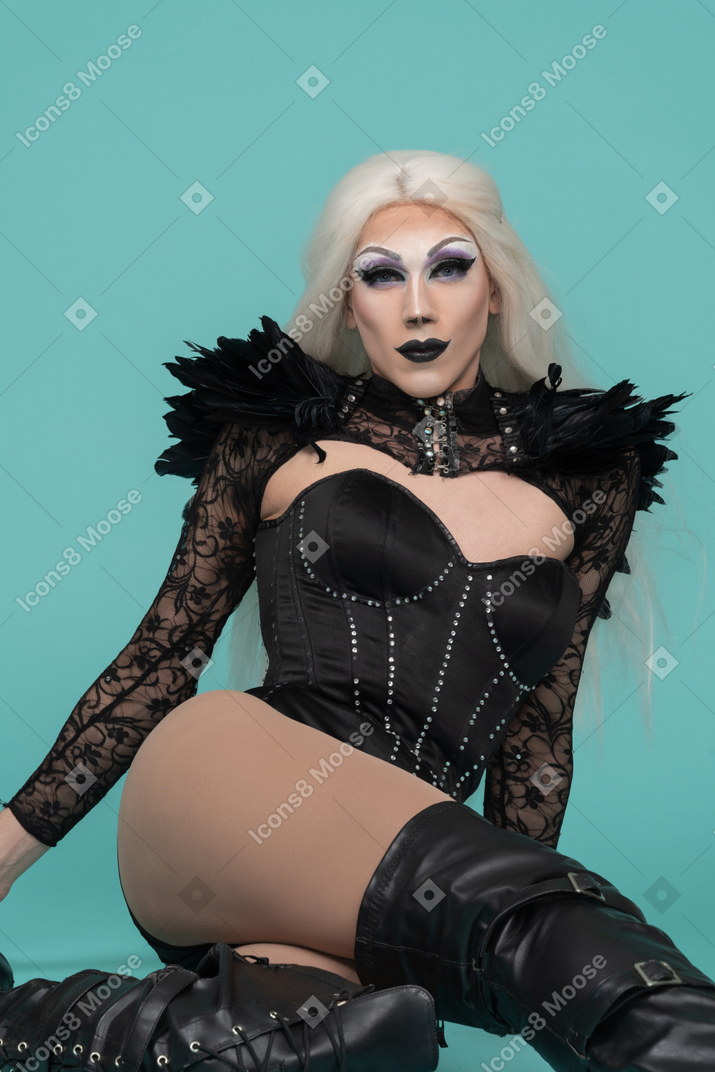 Drag queen sitting and leaning back