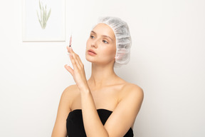 Young woman holding syringe