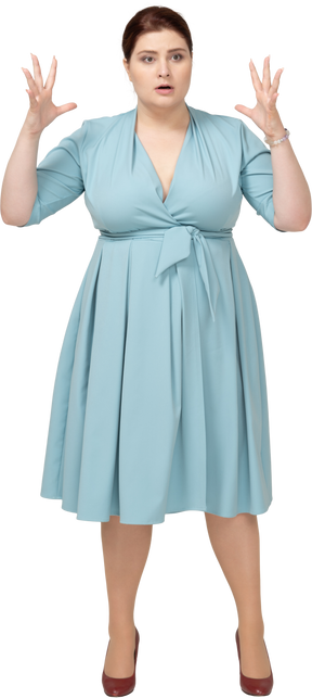 Front view of a woman in blue dress gesturing