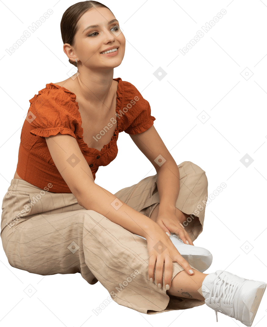 Mujer joven sentada en el piso