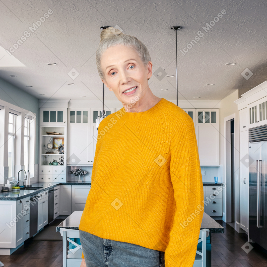 A woman in a yellow sweater standing in a kitchen
