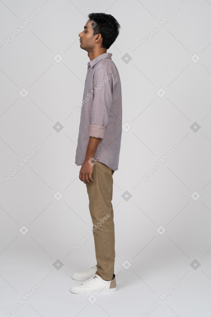 Young man in casual clothes standing