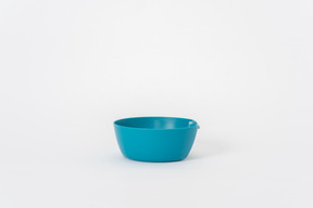 Plastic blue bowl on a white background