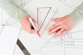Male hands drawing architecture samples
