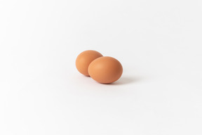 Brown chicken eggs on a white background