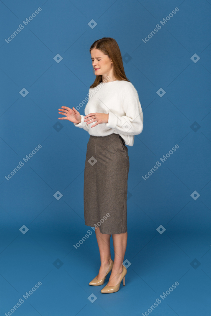 Young businesswoman cringing