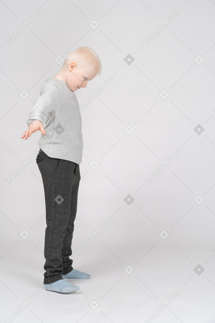 Side view of a boy looking down