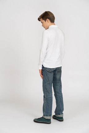 Young man in casual clothes standing