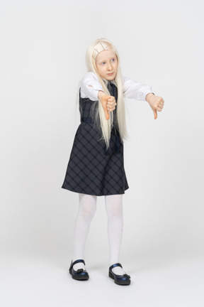 Schoolgirl with long hair showing thumbs down