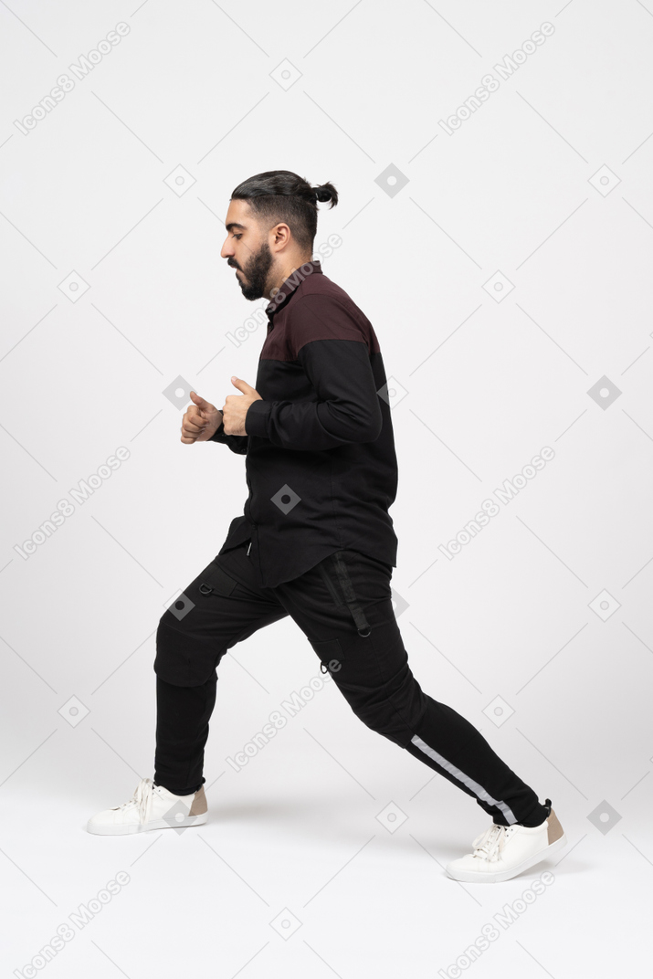 A young man lunging forward