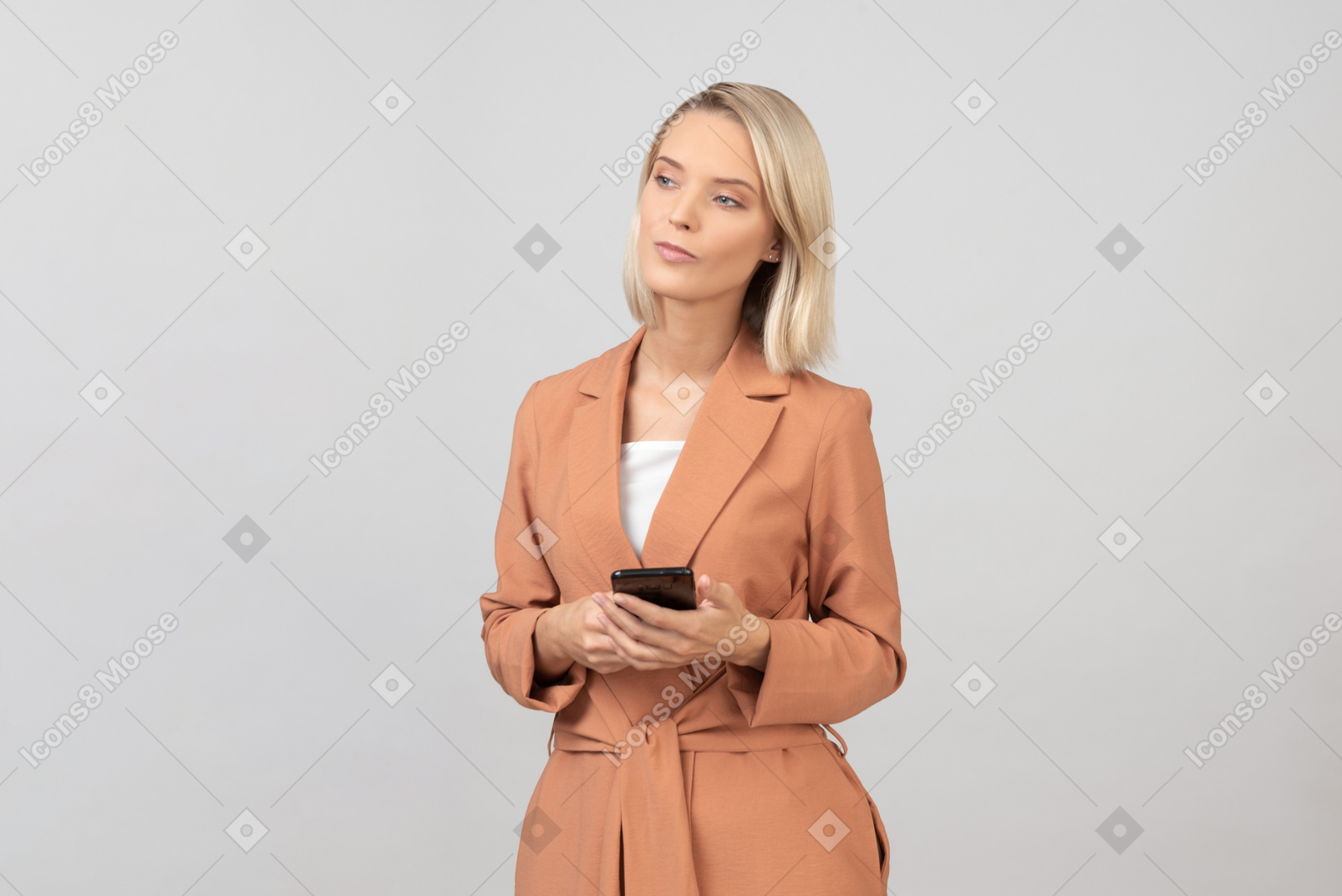 Contemplative young woman holding a smartphone