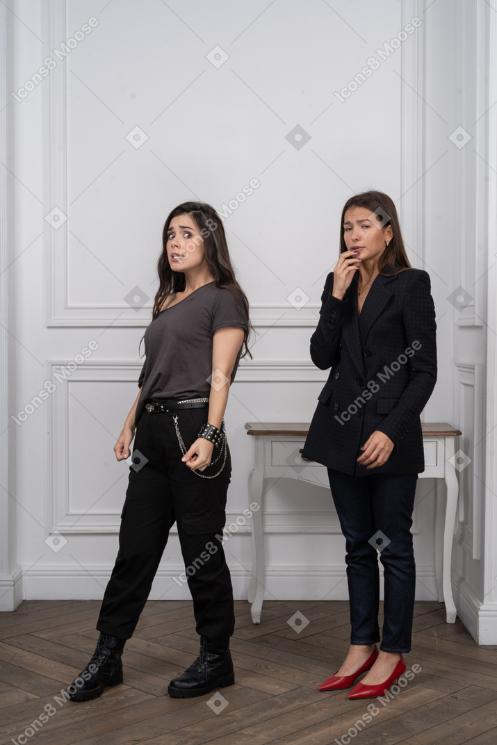 Two women looking distressed