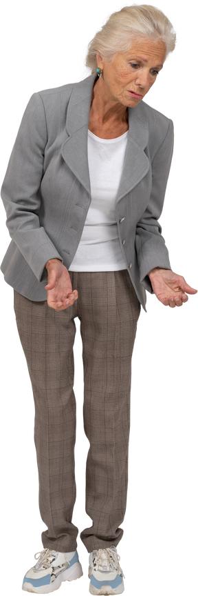 Front view of an old lady in suit explaining something