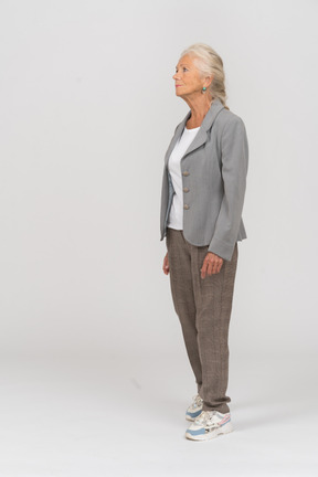 Old lady in suit standing in profile