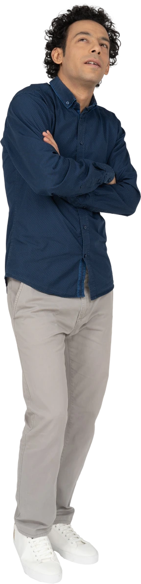 Front view of a man in casual clothes posing with crossed arms