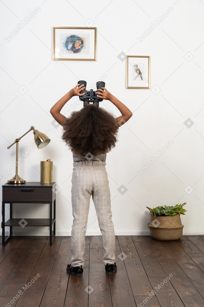 Cute girl posing on the background of the apartment