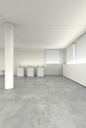 White room with concrete floor and printers