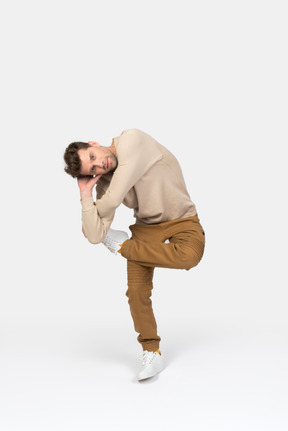 Young guy standing in hip hop dance position