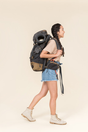 Young asian female hiker standing in profile