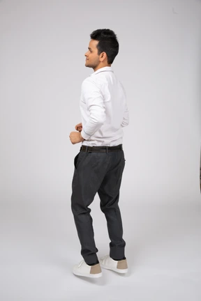 Man in white shirt walking