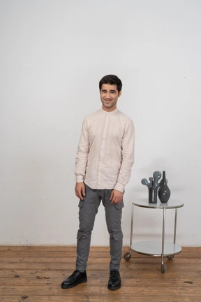 Front view of a man in casual clothes looking at camera