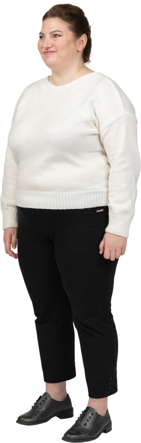 Happy plump woman in casual clothes standing