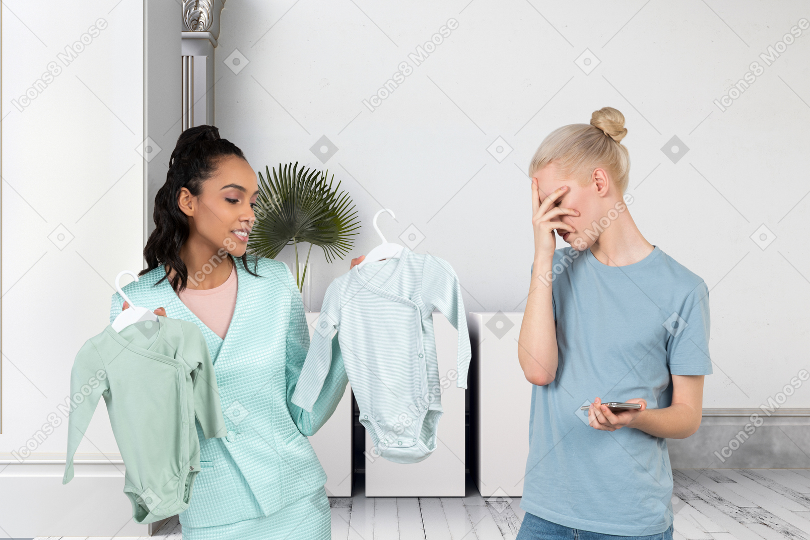 Woman and person looking at baby clothes