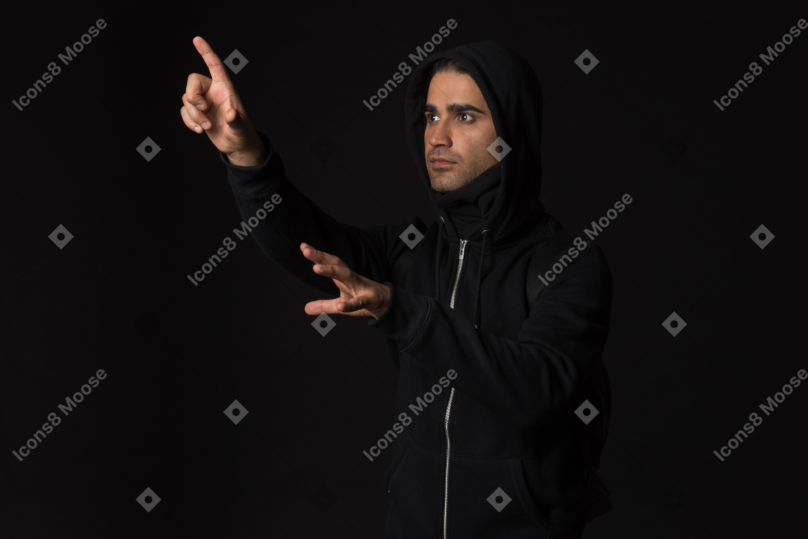 Hacker guy standing in the dark and like touching something with hands