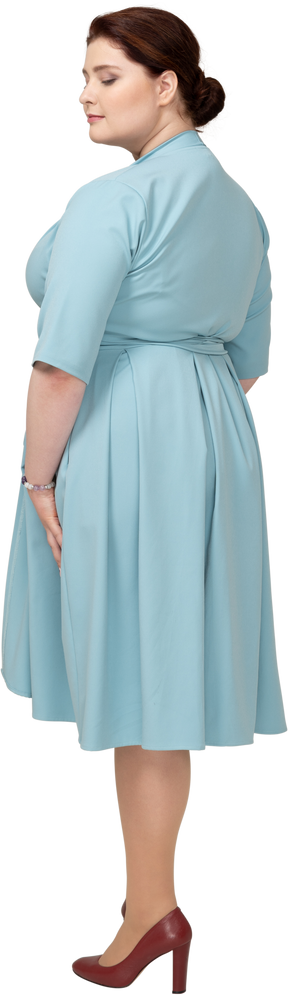 Rear view of a woman in blue dress