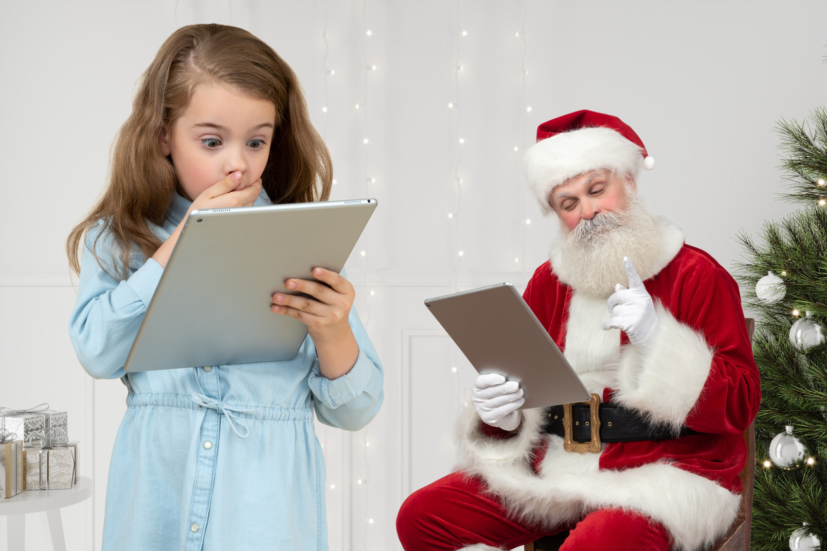 Little girl makes a gift list for santa