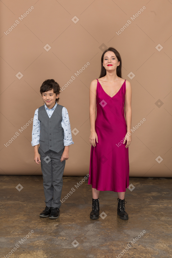 Boy and woman looking away