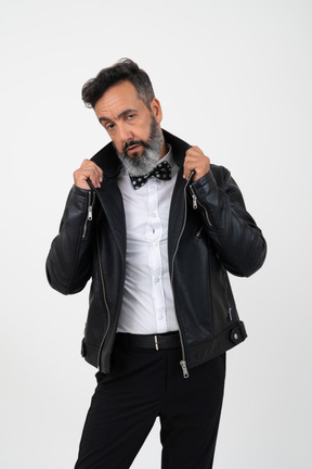 Curious mature man in leather jacket