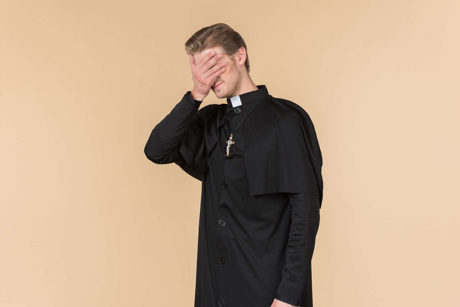 Catholic priest holding cross with cross elongated