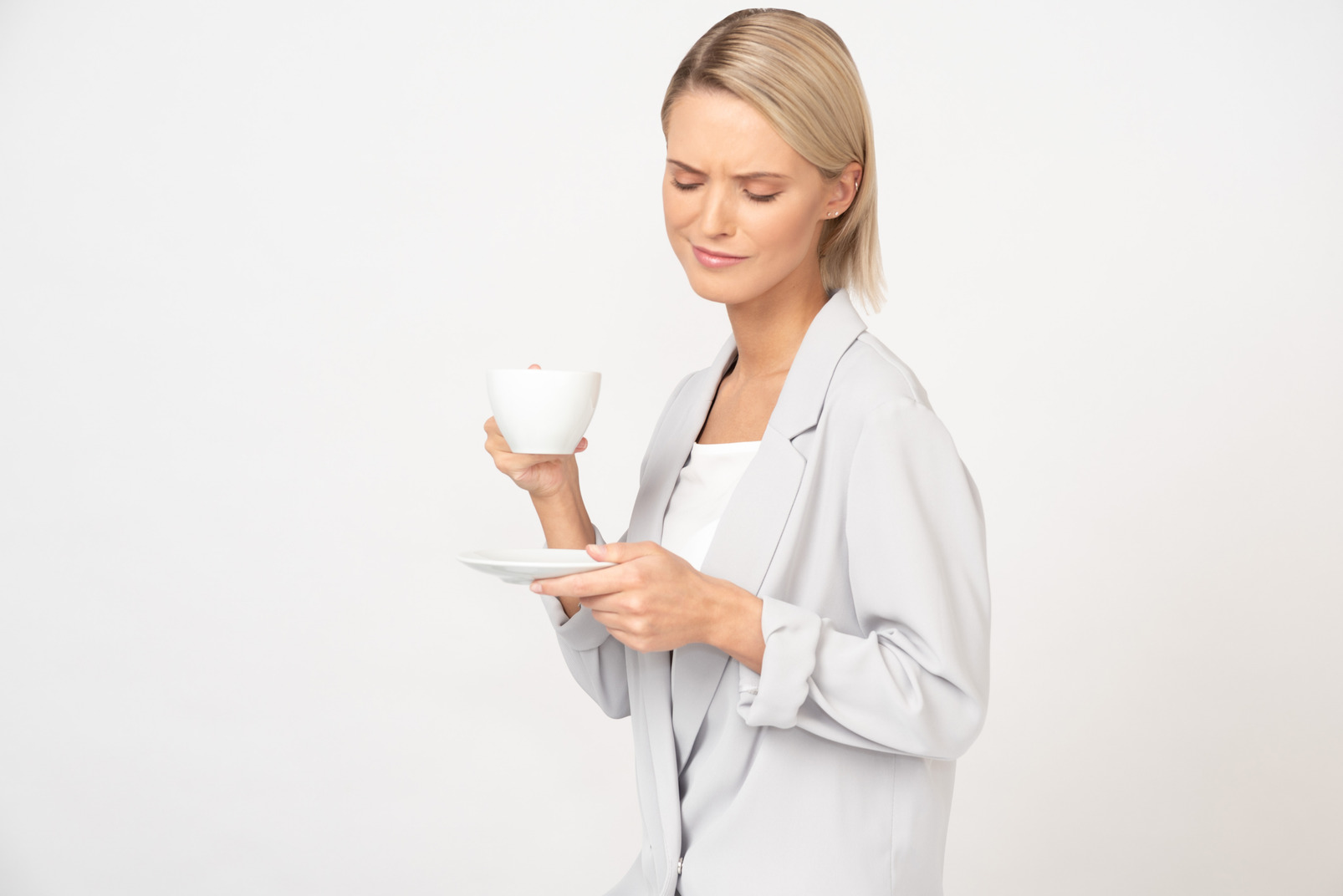 Young businesswoman is having a cup of coffee