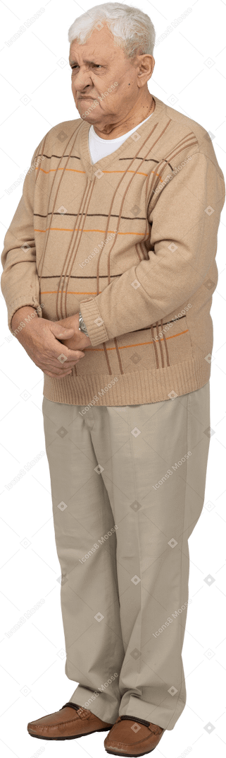 Front view of an angry old man in casual clothes