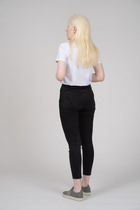 Rear view of a young blonde girl