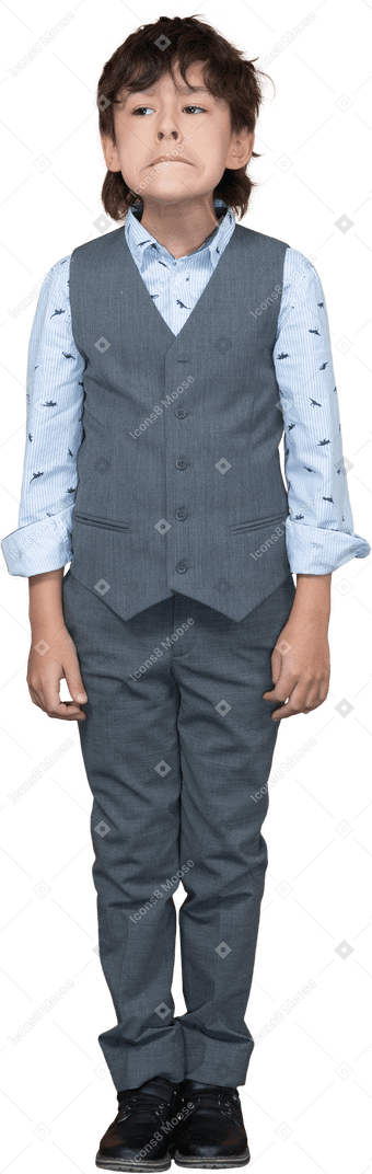 Front view of a boy in suit making faces