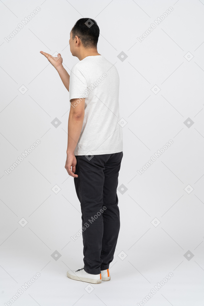 Man in casual clothes blowing a kiss